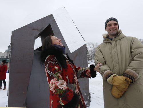 Tanya Tagaq, an Inuk throat singer from Nunavut and Peter Hargraves  with Sputnik Architecture on The Forks river trail Monday to unveil the IN THE LIGHT OF THE KULLIK warming hut.  The design of In the Light of the Kullik is a collaborative effort between Tanya Tagaq and local architecture firm Sputnik Architecture. The metal form will be removed leaving the snow sculpture. Alex Paul story Wayne Glowacki / Winnipeg Free Press Jan. 25 2016