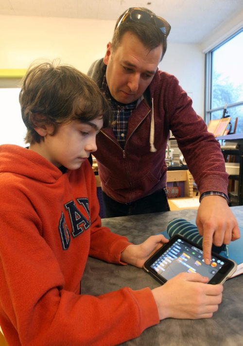 George Waters Middle School 190 Ferry Road in St James- student Tyler Poolie uses Ipad to learn about coding with teacher Carmen Bonnici - See Nick Martin Story- Jan 25, 2016   (JOE BRYKSA / WINNIPEG FREE PRESS)