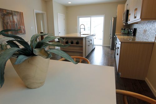HOMES - 49 Angela Everts Drive in Crocus Meadows. From dining room to kitchen view. BORIS MINKEVICH / WINNIPEG FREE PRESS January 25, 2016