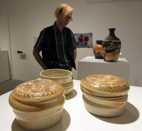 WINNIPEG, MB - ART STANDUP - Michael Joyal checked out some of the crafty art that is showing in the Cre8ery Gallery & Studios. The front art is called Latte Tea Bowls (2015) wood fired porcelain by Brigitta Urben. For the Love of Craft. Manitoba Arts Council. BORIS MINKEVICH / WINNIPEG FREE PRESS January 26, 2016