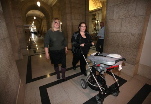Fort Rouge MLA Jennifer Howard, her wife, Tara Peel and their daughter   8-month-old daughter, Georgia,  head to NDP Caucus door prior to  press conference announcing  Howard not seeking re-election and departure from the NDP party at the Leg Wednesday afternoon.    Jan 27, 2016 Ruth Bonneville / Winnipeg Free Press