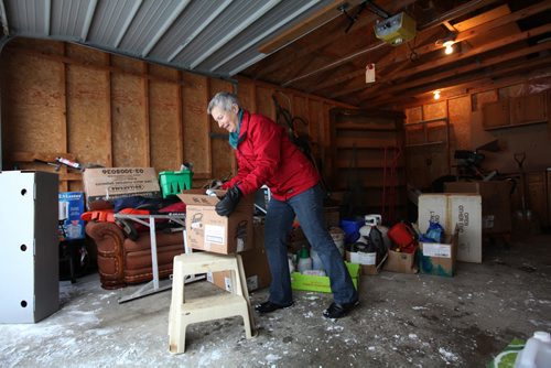 Professional Organizer Susan Macaulay, owner of  Clarity Over Clutter, organizes and and moves boxes of belongings from a homeowner relocating to another city for story for Ent story on decluttering.  See Erin Lebar's story.   Jan 27, 2016 Ruth Bonneville / Winnipeg Free Press