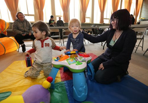 Jennifer Doyle (right) and her son Silas Cornwell (14 months) play at Agape Table for Kids on Jan. 27, 2016 with Keenan Shipley, 2. At left was Cornwell's aunt Teagan Unraw. The afternoon program focuses on educating pre-school aged children and their parent or caregiver about healthy, balanced nutritional choices and in maintaining a healthy lifestyle. The program also incorporates physical and educational activities. Agape Table is located at 175 Colony St., near Broadway and Osborne Street . Photo by Jason Halstead/Winnipeg Free Press RE: Social Page