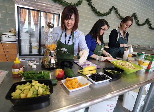 L-R: Sinae Choi, Jen-Jen Malang and Helina LeClair-Reimer prepare food at Agape Table for Kids on Jan. 27, 2016. The afternoon program focuses on educating pre-school aged children and their parent or caregiver about healthy, balanced nutritional choices and in maintaining a healthy lifestyle. The program also incorporates physical and educational activities. Agape Table is located at 175 Colony St., near Broadway and Osborne Street . Photo by Jason Halstead/Winnipeg Free Press RE: Social Page