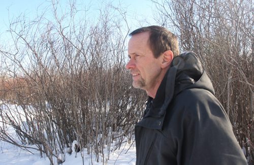 Cal Dueck, a member of the Parker Wetlands Conservation committee walks through the Parker Land forest- Environmental advocates are upset the province has allowed Manitoba Hydro to relocate transmission lines across the Parker lands despite an appeal of an environmental license for all transit corridor-related work on the same lands.-See Aldo Santin story- Jan 28, 2016   (JOE BRYKSA / WINNIPEG FREE PRESS)