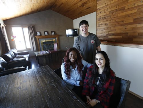 Residential Treatment Workers Richard Guenter with Jemimah Seidu,left, and Ximena Altamirano  in the New Directions home in the RM of Springfield where 3 intellectually disabled men live. Carol Sanders story Wayne Glowacki / Winnipeg Free Press Jan. 28 2016