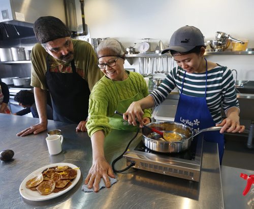 From left, Marcel Sanderson, Julia Lavarias and Mona Geron making pancakes with spelt flour served with a sprinkle of cheese instead of syrup. They are taking a sour dough workshop taught by traditional food teacher Wendy Erlanger at the NorWest Co-op Community Food Centre Thursday.  The story is about healthy eating and access to food along with soaring rates of diabetes.  Kristin Annable story Wayne Glowacki / Winnipeg Free Press Jan. 28 2016