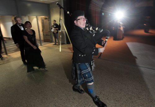 A piper leads the Head Table into the Centennial Women's Gala, Celebrating 100 Years of Manitoba Women's Right to Vote. See Story. January 28, 2016 - (Phil Hossack / Winnipeg Free Press)