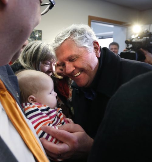Gord Mackintosh, St. Johns MLA says hello to three month old Sadie McDowell as he arrives for a press conference at his constituency office Friday to announce he will not be seeking re-election.  Larry Kusch story Wayne Glowacki / Winnipeg Free Press Jan. 29 2016