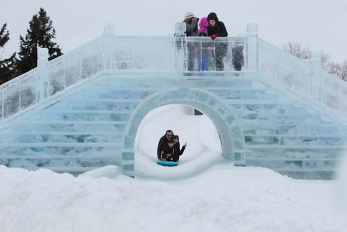 Kids and and families enjoy the view from the ice bridge a toboggan slide that runs under it at The Great Ice Show at the Forks Saturday. Standup photo  Jan 30, 2016 Ruth Bonneville / Winnipeg Free Press