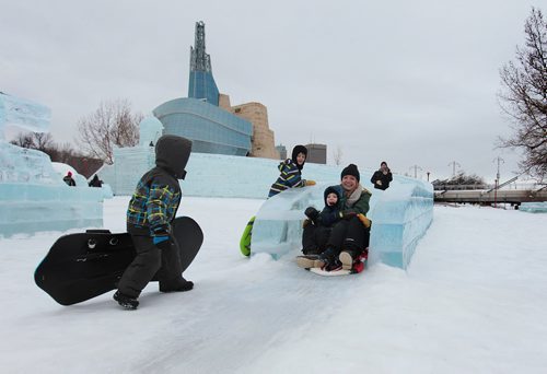 Tara Vanasse and six-year-old Lennon Caissy scream as they make their way down the castle slide while their family members watch at The Great Ice Show at the Forks Saturday. Standup photo  Jan 30, 2016 Ruth Bonneville / Winnipeg Free Press