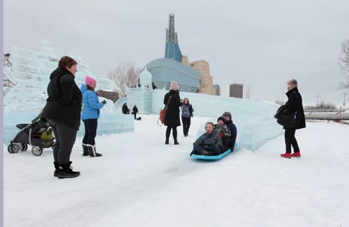 Kids and families are all smiles as they make their way down the castle slide while their family members watch at The Great Ice Show at the Forks Saturday. Standup photo  Jan 30, 2016 Ruth Bonneville / Winnipeg Free Press