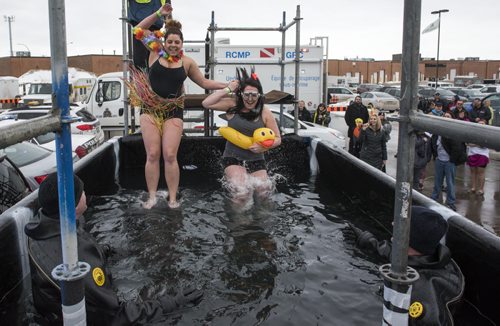 DAVID LIPNOWSKI / WINNIPEG FREE PRESS 160130  Cyrena Couvier (left) and Lindsay Wiltshire (right) take the polar plunge at the Holiday Inn on Ellice Avenue Saturday afternoon. Law Enforcement and community members took the plunge to raise awareness and funds for Special Olympics Manitoba sport programs.