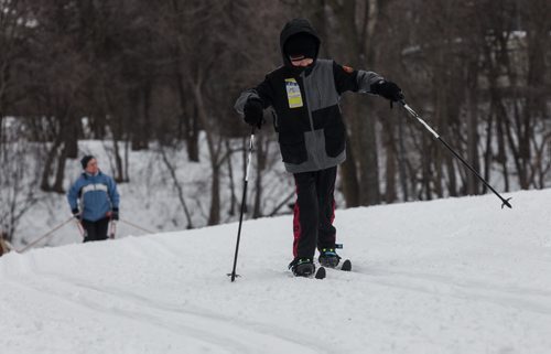 Sue Quenelle (background) and her grandson Cayden, 9, taking advantage of the warmish weather at the Windsor Park Nordic Centre Sunday morning. 160131 - Sunday, January 31, 2016 -  MIKE DEAL / WINNIPEG FREE PRESS