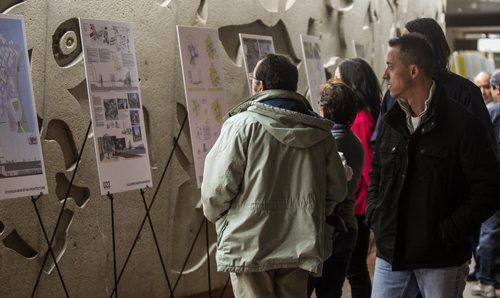 Office workers in the rotunda underneath Portage and Main take an opportunity to look at some of the architectural renderings on display.   160201 - Monday, February 1, 2016 -  MIKE DEAL / WINNIPEG FREE PRESS