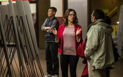 Melanie Andrushko with the Downtown BIZ talks to people who have stopped in the rotunda underneath Portage and Main to take an opportunity to look at some of the architectural renderings on display.   160201 - Monday, February 1, 2016 -  MIKE DEAL / WINNIPEG FREE PRESS