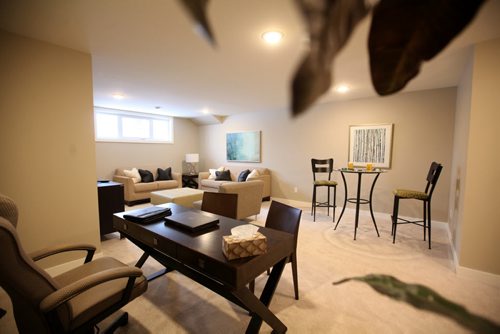 TriWest Show Home at 516 Ferry Rd is example of a new home in older neighbourhood.  Great new home for infill housing.    Contact, Ken Smith.  Pre-fab home built off-site and placed onto foundation.    Large, open-span basement with  high ceilings and large windows.    February 2, 2016 Ruth Bonneville / Winnipeg Free Press