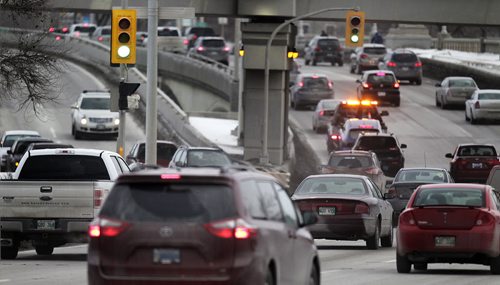 Traffic and traffic lights at Queen Elizabeth Way Tuesday. See story re: new traffic Light system for the city.....February 2, 2016 - (Phil Hossack / Winnipeg Free Press)