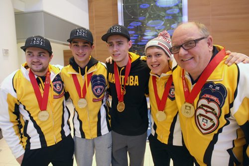 L to R -Matt Dunstone, Colton Lott, Kyle Doering , Rob Gordon, and coach Calvin Edie at James A International airport in Winnipeg Monday after returning home with the Canadian Jr Curling Championship they won in -Melissa Martin story- Feb 01, 2016   (JOE BRYKSA / WINNIPEG FREE PRESS)