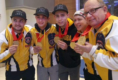 L to R -Matt Dunstone, Colton Lott, Kyle Doering , Rob Gordon, and coach Calvin Edie at James A International airport in Winnipeg Monday after returning home with the Canadian Jr Curling Championship they won in -Melissa Martin story- Feb 01, 2016   (JOE BRYKSA / WINNIPEG FREE PRESS)