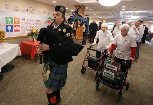 Piper Colleen Morrison of Army, Navy, ANAVETS 283 pipes in organizers at the opening of the All Seniors Care Seniors Games at Sturgeon Creek Retirement Residence on Feb. 1, 2016. Photo by Jason Halstead/Winnipeg Free Press RE: Social Page