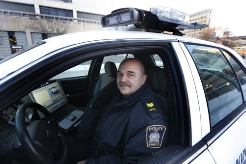 Winnipeg Police Service Patrol Sgt. Lou Malo, Central Traffic Enforcement Co-ordinator in a police car with automated  licence plate reading equipment . Above his head on the roof is one of three cameras that simultaneously scan licence plates of vehicles. Winnipeg Police Service uses licence-plate scanning technology to find stolen cars and drivers with suspended licences or other infractions. Its the same technology that makes MPIs licence-renewal decals obsolete.  The officer is alerted on the computer screen when a flagged vehicle is found. Katie May story Wayne Glowacki / Winnipeg Free Press Feb.4 2016