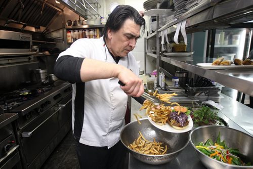 In Fernos Bistro- 312 Des Meurons St- Owner Fern Kirouac busy in the kitchen  -See David Sanderson This City Feature  Feb 04, 2016   (JOE BRYKSA / WINNIPEG FREE PRESS)