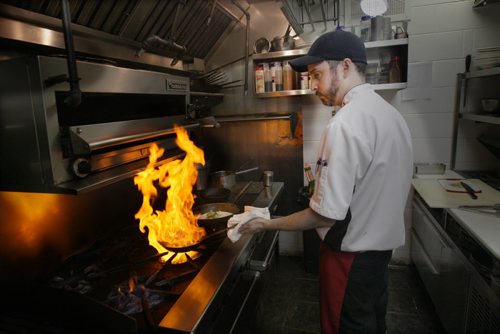 In Fernos Bistro- 312 Des Meurons St- Chef Sean McGillvary busy in kitchen with lunch crowd orders-See David Sanderson This City Feature  Feb 04, 2016   (JOE BRYKSA / WINNIPEG FREE PRESS)