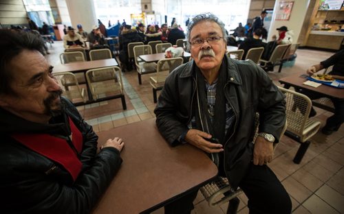 Joseph Meconse, 74, was kicked out of the Portage Place Mall's food court for loitering last Friday. The Sayisi Dene elder, military veteran and Order of Manitoba recipient hasn't let the issue keep him away from his usual spot in the food court though he is hoping that the person who kicked him out will apologize. On the left is his friend, Blaine Harris who was with Joseph when he was kicked out. 160204 - Thursday, February 4, 2016 -  MIKE DEAL / WINNIPEG FREE PRESS