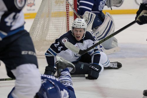 Manitoba Moose #24 Scott Kosmachuk gets tripped next to Toronto Marlies net during the second period of action at the MTS Centre Thursday.  The score after the 2nd period is 4 - 0 for Toronto.   February 04, 2016 Ruth Bonneville / Winnipeg Free Press
