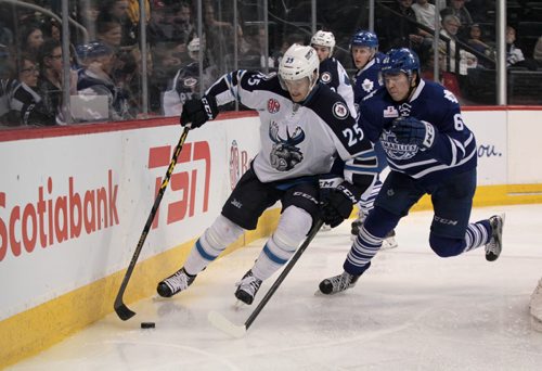 Manitoba Moose #25 Matt Fraser tries to keep control of the puck away from  Toronto Marlies #61 Rinat Valiev  during the second period of action at the MTS Centre Thursday.   February 04, 2016 Ruth Bonneville / Winnipeg Free Press