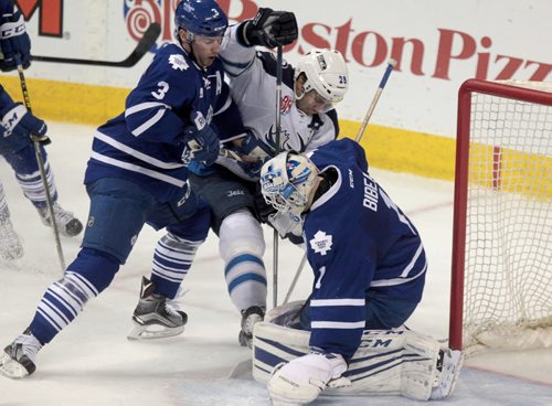 Manitoba Moose #28 Patrice Cormier desperately tries to get the puck  Toronto Marlies goalie #1 Antoine Bibeau during the 3rd period of action   at the MTS Centre Thursday.  The final score was 6 - 2 for Toronto.   February 04, 2016 Ruth Bonneville / Winnipeg Free Press