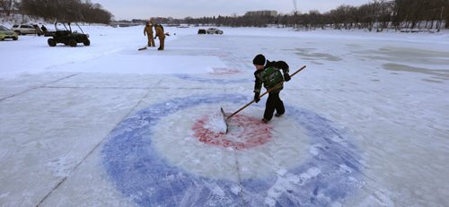 IRONBOY. Colby Henry,8, lends a hand on his day off from school (inservice) cleaning off the snow on one of the 10 curling rinks on the Red River near The Forks for this weekend's Annual Ironman Outdoor Curling Bonspiel. The opening ceremonies are at 4:30 P.M. Friday and action goes through the weekend with 80 teams enjoying the great outdoors with proceeds going to the Heart and Stroke Foundation of Manitoba.Wayne Glowacki / Winnipeg Free Press Feb.5 2016