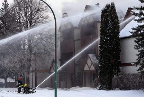 Fire crews battle a fire at Tudor Village on Ulster St. at Greencrest  Ave. in Fort Richmond Friday morning. Wayne Glowacki / Winnipeg Free Press Feb.5 2016