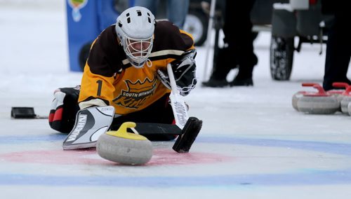 Tony Staruch participates in the media challenge prior to the Ironman Outdoor Curling Bonspiel at The Forks, Friday, February 5, 2016. (TREVOR HAGAN/WINNIPEG FREE PRESS)