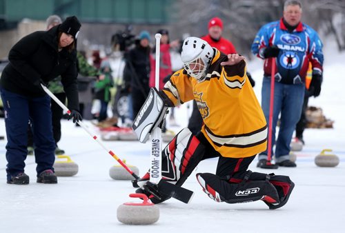 Tony Staruch tries to stop a shot during the media challenge prior to the Ironman Outdoor Curling Bonspiel at The Forks, Friday, February 5, 2016. (TREVOR HAGAN/WINNIPEG FREE PRESS)