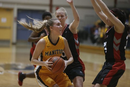 University of Manitoba Bisons player #8 Emma Thompson eyes her next move during game against U of W  Wesman  at the 25th Annual Duckworth Challenge held at Investors Group Athletic Centre Friday night.  Wesman went on to win the game against the Bisons 69 - 64. February 05, 2016 Ruth Bonneville / Winnipeg Free Press