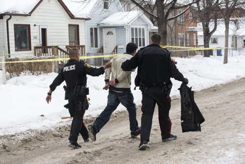 DAVID LIPNOWSKI / WINNIPEG FREE PRESS 160206  A man is taken into police custody after getting into an altercation at the scene of an unrelated crime Saturday February 6, 2015 in the 500 block of Stella Avenue.