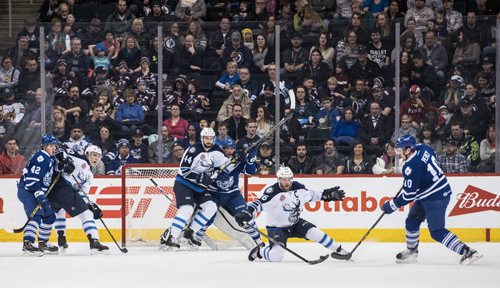 DAVID LIPNOWSKI / WINNIPEG FREE PRESS 160206  Manitoba Moose #16 John Albert tries to block Toronto Marlies #10 Stuart Percy's shot Saturday February 6, 2015 at MTS Centre.