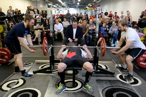 A competitor bench presses during the Manitoba Powerlifting Association event at the Brickhouse Gym, Saturday, February 6, 2016. The event was 3 events, bench press, squat and deadlift. (TREVOR HAGAN/WINNIPEG FREE PRESS)