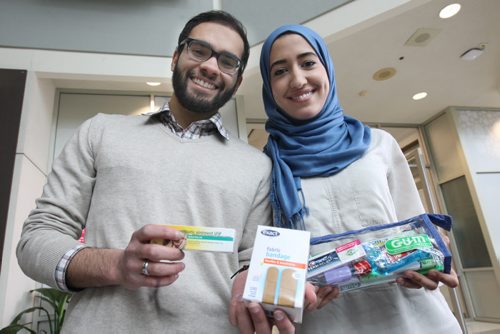 Medical student Rami Elzayat, left, with his girlfriend Dental student Israa Elgazzar each holding contents for sample health pack they and other health sciences students are preparing for Syrian  refugees-See Carol Sanders story- Feb 08, 2016   (JOE BRYKSA / WINNIPEG FREE PRESS)