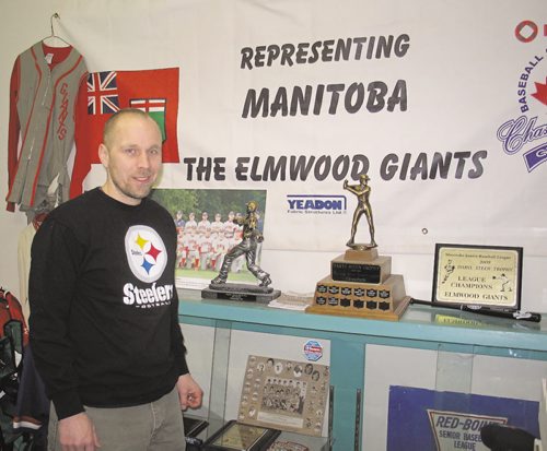 Canstar Community News Along with sports cards and collectibles, Lower Level Sports' owner Mike Bergmann maintains a display commemorating the successes of the Elmwood Giants baseball club. (SHELDON BIRNIE/CANSTAR/THE HERALD)