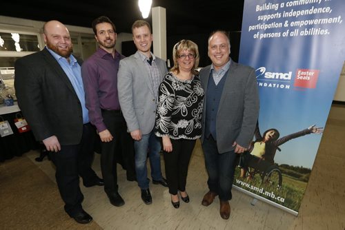 February 8, 2016 - 160208  -  SMD major sponsor Molson Canadian sales representatives (from left) Aaron Koch, Jesse Adamyk, Scott Bastone, with Maria Marrone, COO, SMD Foundation and Jason Fuchs, Molson Canadian Sales Director MB at the SMD Foundation Attire to Aspire fashion show fundraiser at the Assiniboia Downs Monday, February 8, 2016.  John Woods / Winnipeg Free Press