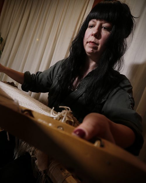 February 1, 2016 - 160201  - Kelly Ruth plays her loom during a rehersal in her home Monday February 1, 2016. Ruth, a textile artist, who not only weaves on her loom has turned it into a musical instrument, by amplifying it and "playing" it while she works. Kelly is part of a three-piece group mad up of a bassoon, cello and loom. John Woods / Winnipeg Free Press