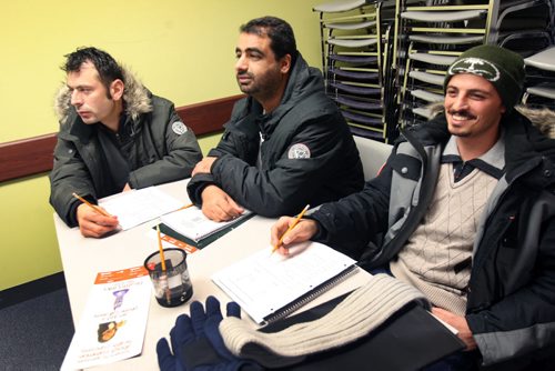 Syrian refugees at the Arabic Express program  its a 2-week orientation and a crash course to help them get survival skills.-259 Portage Ave- L to R   students Sameer Sulaiman Alzoubi, Zyad Al Owimr, and Hatem Almahmoud-See Carol Sanders story - Feb 09, 2016   (JOE BRYKSA / WINNIPEG FREE PRESS)