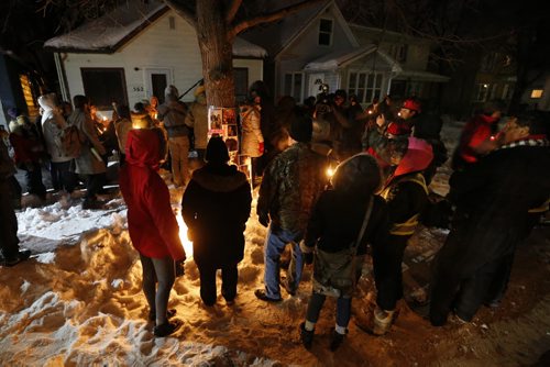 February 9, 2016 - 160209  -  Friends and family gather outside 556 Stella Avenue to remember Winnipeg's latest murder victim Mavis Ducharme Tuesday, February 9, 2016.  John Woods / Winnipeg Free Press