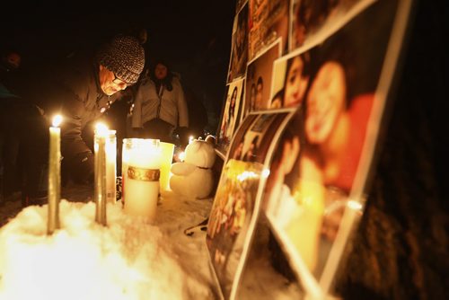 February 9, 2016 - 160209  -  Friends and family gather outside 556 Stella Avenue to remember Winnipeg's latest murder victim Mavis Ducharme Tuesday, February 9, 2016.  John Woods / Winnipeg Free Press