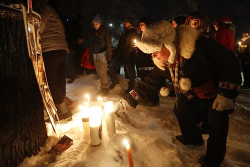 February 9, 2016 - 160209  -  Friends and family gather outside 556 Stella Avenue to remember Winnipeg's latest murder victim Mavis Ducharme Tuesday, February 9, 2016.  John Woods / Winnipeg Free Press