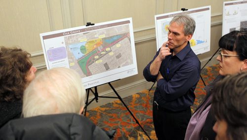 LOCAL - Parker Lands open house/protest. OPEN HOUSE - Geoff Zywina, VP of Design and Construction at Gem Equities, unveils some of his plans for transit-oriented development at the Parker lands this afternoon in Fort Garry, while protestors gather outside.  Geoff Zywina/Gem Equities designer talks to interested people at the event. BORIS MINKEVICH / WINNIPEG FREE PRESS February 10, 2016