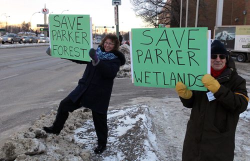 LOCAL - Parker Lands open house/protest. OPEN HOUSE - Developer Andrew Marquess unveils some of his plans for transit-oriented development at the Parker lands this afternoon in Fort Garry, while protestors gather outside.  Protesters Sherry Loat and Paul Bagamery hold up signs in front of the Holiday Inn on Pembina. BORIS MINKEVICH / WINNIPEG FREE PRESS February 10, 2016
